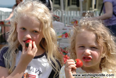 Two girls enjoy the fruits