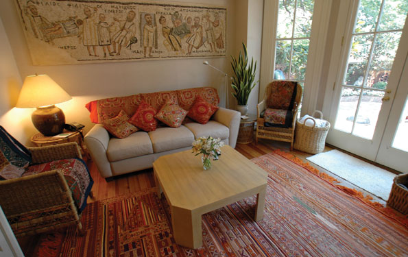 Colorful pillows, throws, and a rug from India enliven the tv room. 
