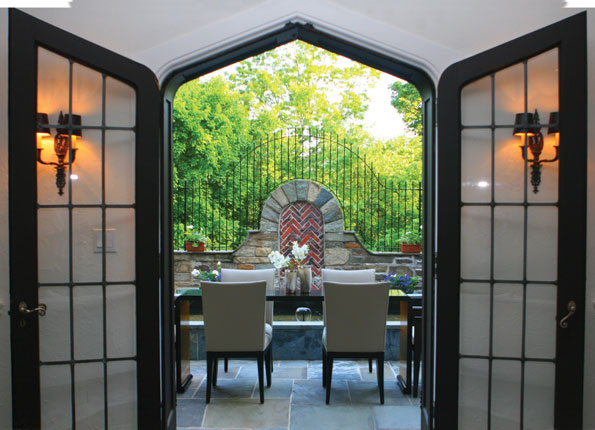 Romanesque decorative brickwork is cleverly employed to create a focal point for the garden terrace. 