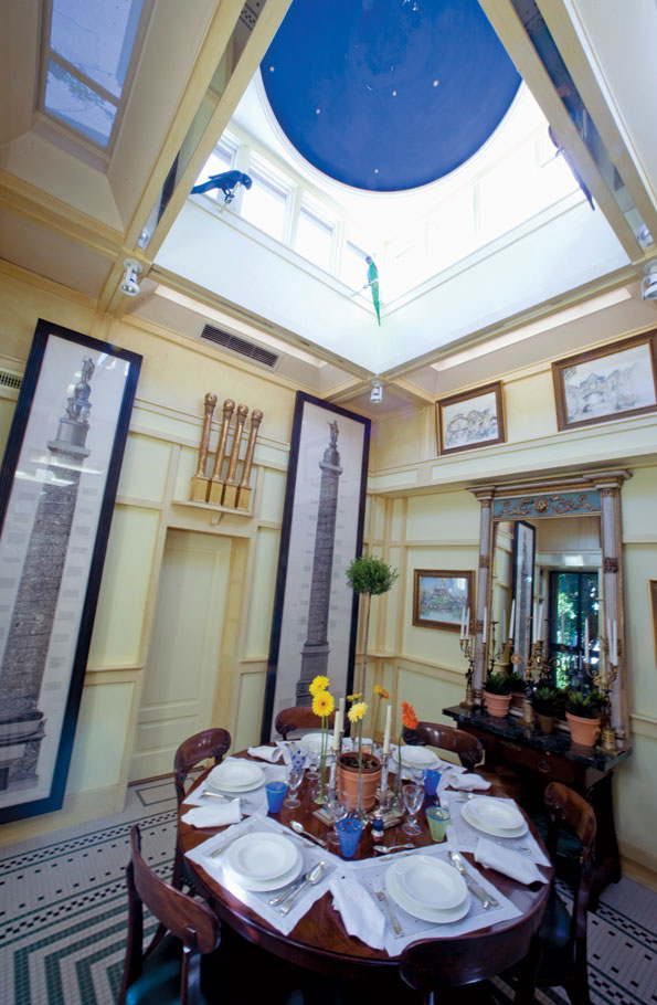 The breakfast room designed by local architect Outerbridge Horsey in the 1990s features a cupola, wonderful light and two magnificent Piranesi prints. 