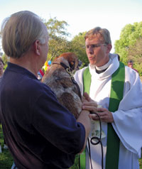 Rev. Robert Banse Jr. blessed Jimmy Hatcher’s Jack Russell at Trinity Church in Upperville.