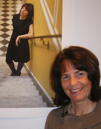 Finola Bruton, wife of the European Union’s ambassador, poses near her portrait taken by Washington-based photographer Abby Greenwalt