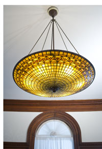 This Tiffany chandelier hangs in the dining room at the Twin Oaks estate and was part of the completed building's original furnishings in 1888