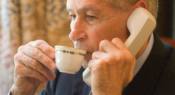 Ambassador Castellaneta enjoys an espresso while attending to business in his den. 