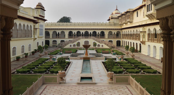 The gardens at Rambagh Palace Hotel in the capital city of Rajasthan, Jaipur. The hotel served as the home of the royal family of Jaipur until 1957.