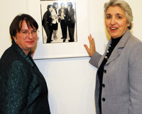 Kim Gandy and Eleanor Smeal beside an Avedon portrait of Eleanor