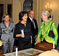 Curator Marcee Craighill (center) greets her predecessor, Gail Serfaty, at a recent Diplomatic Reception Rooms dinner.