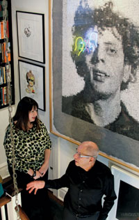 Reis and Aaron Levine in front of a work by Chuck Close (Photos by Santos)