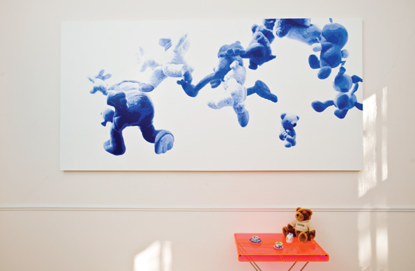 Hiroshi Kobayashi’s large scale painting, “Baby Balloon,” figurative and abstract, shows the artist’s command of perspective and is an example of his unique technique reminiscent of “paint by numbers.”