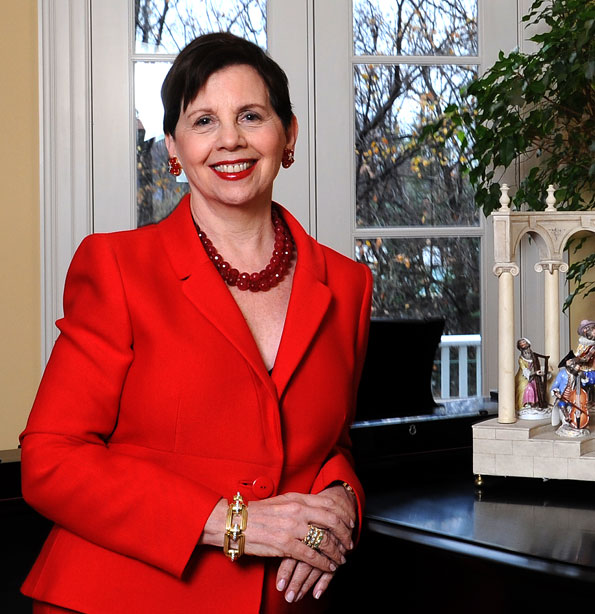 Adrienne Arsht poses near a collection of porcelain figurines in her new home. (Photo by Joseph Allen)