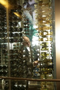 General Manager / Sommelier Brian Zipin selects a bottle of wine from Central's cellar.