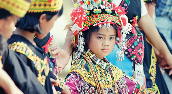 A child from one of Taiwan’s 14 indigenous tribes wears traditional dress.
