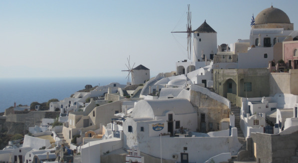 The old windmills built at the edge of Oia.