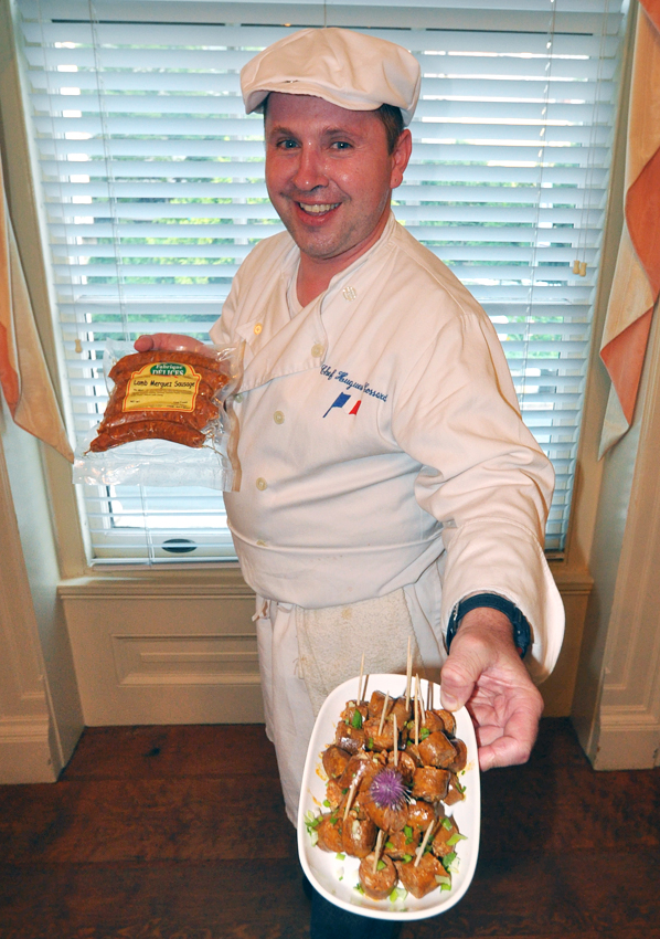 Food Expressions’ Hugh Cossard displays a plate of traditional summer chipolata pork sausage