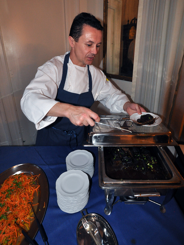 Chef Patrick Moulet of the Petits Plats restaurant serves braised short ribs