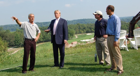 Trump confers with staff last week at his newly-acquired Trump National Golf Club. Photo by John Arundel/Washington Life. 