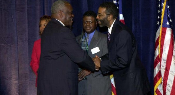 Mr. Wims is presented an award by Supreme Court Justice Clarence Thomas.