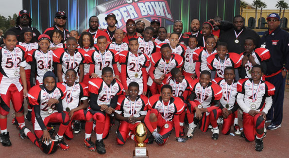 The Beacon House Junior Pee Wee Falcons bring home the Pop Warner Superbowl trophy. (Photo courtesy of Beacon House)