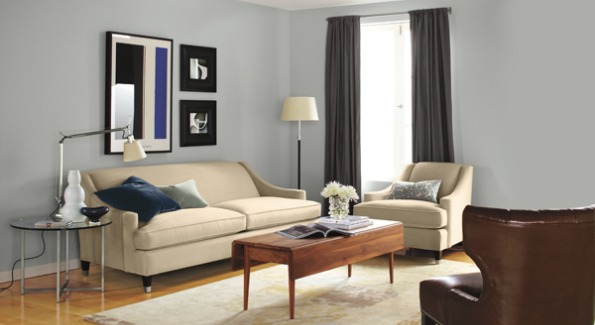 Room and Board's Loring Sofa serves as a neutral base for bright purple accents.