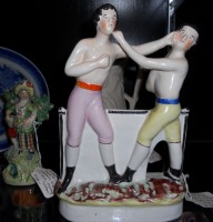 boxing Staffordshire Group of John Heenan and Tom Sayers (England, ca. 1870, $1,850) from James M. Labaugh Antiques.
