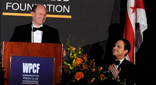 Sen. Chris Coons (D-Del.) gets laughs from the audience at the Washington Press Club Foundation dinner. (Tom Williams)