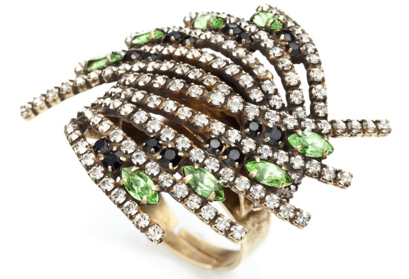 "Vaughn" cocktail ring with diamonds, emeralds, and Swarovski crystal elements on an oxidized brass-plated ring. ($245); Dannijo, www.dannijo.com.
