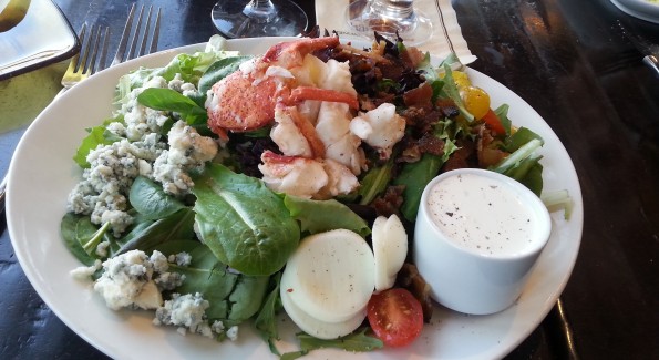 The Lobster Cobb Salad at Harvest is topped with a mound of succulent shellfish. Photo courtesy of Kelly Magyarics.