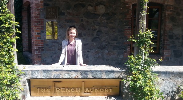 The author poses in front of the famed restaurant The French Laundry after a tour of Chef Thomas Keller's culinary garden. Photo courtesy of Kelly Magyarics.