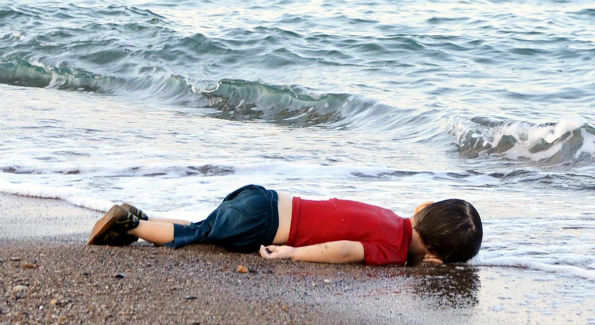 This photo of young Syrian boy Aylan Shenu drowned on a Turkish beach, after a boat carrying refugees to the Greek island of Kos, sank, sparked outrage around the world. It was a wake-up call to many, a tragedy that captured the severity of the worst migrant crisis since World War II. (Credit: AFP Photo/Nelufer Demir/Dogan News Agency) 
