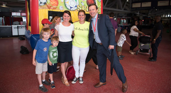 Sen. Chris Murphy and family with Ellen Palmer, director, Home Runs for Horton's Kids. Photo by Jenn Reid & Jim Kurtz.